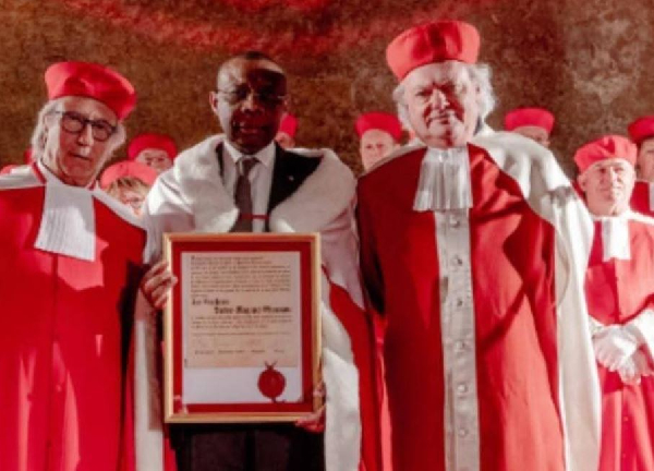 Il se présente comme un chrétien pratiquant qui fut enseigné par Maurice KAMTO à l'IRIC